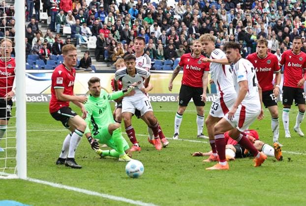29 09 2024 Soccer Season 2024 2025 2 Soccer Bundesliga 07 Matchday Hannover 96 H96 1 FC Nürnberg FCN Club Sportfoto Zink DaMa xdaxmax DFL regulations prohibit any use of photographs as image sequences and or quasi video only for editorial use Nick Seidel 33, 1 FC Nürnberg FCN Janni Serra 23, 1 FC Nürnberg FCN blicken Ball hinter her