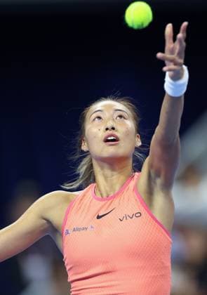 (240930) -- BEIJING, Sept. 30, 2024 -- Zheng Qinwen of China serves during the women s singles 3rd round match against Nadia Podoroska of Argentina at 2024 China Open tennis tournament in Beijing, capital of China, Sept. 30, 2024. ) (SP)CHINA-BEIJING-TENNIS-CHINA OPEN-WOMEN S SINGLES (CN) BaixXuefei 