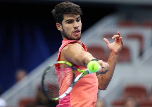 (240930) -- BEIJING, Sept. 30, 2024 -- Carlos Alcaraz of Spain hits a return during the men s singles quarterfinals against Karen Khachanov of Russia at 2024 China Open tennis tournament in Beijing, capital of China, Sept. 30, 2024. ) (SP)CHINA-BEIJING-TENNIS-CHINA OPEN-MEN S SINGLES (CN) ZhangxChenlin 