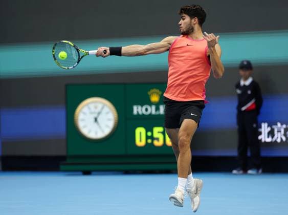(240930) -- BEIJING, Sept. 30, 2024 -- Carlos Alcaraz of Spain hits a return during the men s singles quarterfinals against Karen Khachanov of Russia at 2024 China Open tennis tournament in Beijing, capital of China, Sept. 30, 2024. ) (SP)CHINA-BEIJING-TENNIS-CHINA OPEN-MEN S SINGLES (CN) ZhangxChenlin 