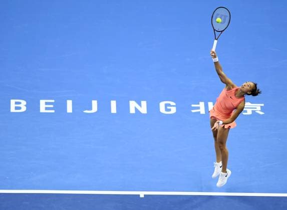 (240930) -- BEIJING, Sept. 30, 2024 -- Zheng Qinwen of China serves during the women s singles 3rd round match against Nadia Podoroska of Argentina at 2024 China Open tennis tournament in Beijing, capital of China, Sept. 30, 2024. ) (SP)CHINA-BEIJING-TENNIS-CHINA OPEN-WOMEN S SINGLES (CN) ZhangxChenlin 