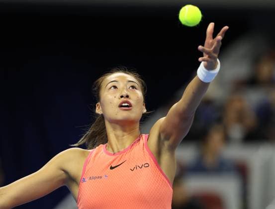 (240930) -- BEIJING, Sept. 30, 2024 -- Zheng Qinwen of China serves during the women s singles 3rd round match against Nadia Podoroska of Argentina at 2024 China Open tennis tournament in Beijing, capital of China, Sept. 30, 2024. ) (SP)CHINA-BEIJING-TENNIS-CHINA OPEN-WOMEN S SINGLES (CN) ZhangxChenlin 