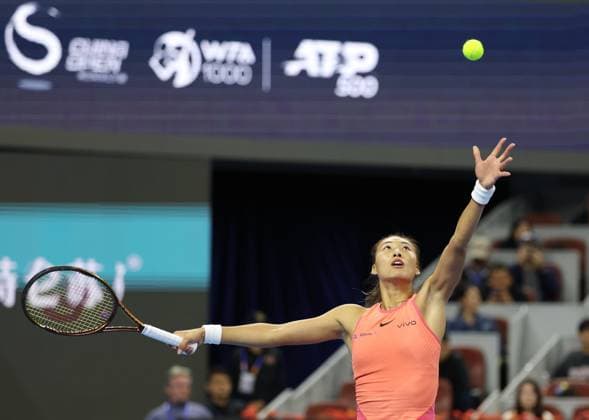 (240930) -- BEIJING, Sept. 30, 2024 -- Zheng Qinwen of China serves during the women s singles 3rd round match against Nadia Podoroska of Argentina at 2024 China Open tennis tournament in Beijing, capital of China, Sept. 30, 2024. ) (SP)CHINA-BEIJING-TENNIS-CHINA OPEN-WOMEN S SINGLES (CN) ZhangxChenlin 