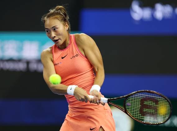 (240930) -- BEIJING, Sept. 30, 2024 -- Zheng Qinwen of China hits a return during the women s singles 3rd round match against Nadia Podoroska of Argentina at 2024 China Open tennis tournament in Beijing, capital of China, Sept. 30, 2024. ) (SP)CHINA-BEIJING-TENNIS-CHINA OPEN-WOMEN S SINGLES (CN) ZhangxChenlin 