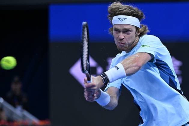 (240930) -- BEIJING, Sept. 30, 2024 -- Andrey Rublev hits a return during the men s singles quarterfinal between Bu Yunchaokete of China and Andrey Rublev of Russia at 2024 China Open tennis tournament in Beijing, capital of China, Sept. 30, 2024. ) (SP)CHINA-BEIJING-TENNIS-CHINA OPEN-MEN S SINGLES (CN) ZhangxLong 