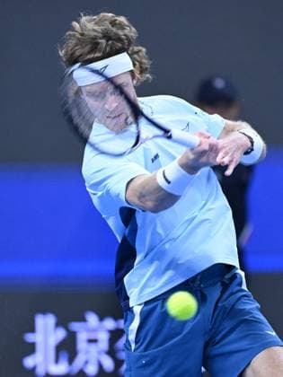 (240930) -- BEIJING, Sept. 30, 2024 -- Andrey Rublev hits a return during the men s singles quarterfinal between Bu Yunchaokete of China and Andrey Rublev of Russia at 2024 China Open tennis tournament in Beijing, capital of China, Sept. 30, 2024. ) (SP)CHINA-BEIJING-TENNIS-CHINA OPEN-MEN S SINGLES (CN) ZhangxLong 