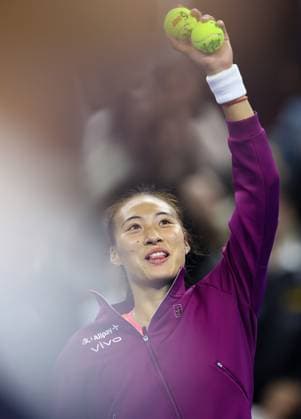(240930) -- BEIJING, Sept. 30, 2024 -- Zheng Qinwen of China holds up tennis balls with her autograph after the women s singles 3rd round match against Nadia Podoroska of Argentina at 2024 China Open tennis tournament in Beijing, capital of China, Sept. 30, 2024. ) (SP)CHINA-BEIJING-TENNIS-CHINA OPEN-WOMEN S SINGLES (CN) BaixXuefei 