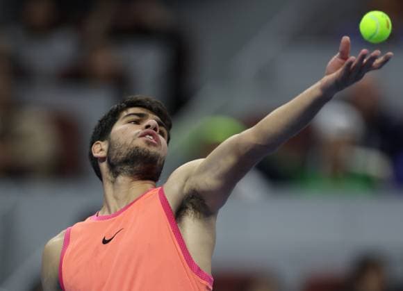 (241001) -- BEIJING, Oct. 1, 2024 -- Carlos Alcaraz of Spain serves during the men s singles semi-final match against Daniil Medvedev of Russia at 2024 China Open tennis tournament in Beijing, capital of China, Oct. 1, 2024. (Photo by Xinhua) (SP)CHINA-BEIJING-TENNIS-CHINA OPEN-MEN S SINGLES (CN) DuxXinyi 