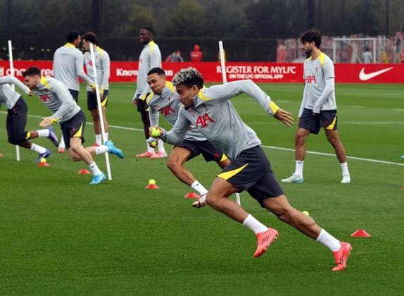 1st October 2024; Anfield and AXA Training Centre, Liverpool, Merseyside, England; press conference, PK, Pressekonferenz and training session ahead of the UEFA Champions League match between Liverpool and Bologna in Liverpool, England; Luis Diaz takes on Andrew Robertson and Trent Alexander-Arnold during today s training session at Liverpool s AXA Training Centre in Kirkby ahead of tomorrow s Champions League match versus Bologna  ActionPlus12698683 AlanxMartin