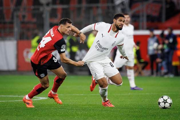 UEFA Champions League, Bayer 04 Leverkusen AC Milan 01 10 2024 Granit Xhaka Bayer 04 Leverkusen, 34 holds Ruben Loftus Cheek AC Milan, 8 in a tackle on the shirt UEFA Champions League, Bayer 04 Leverkusen AC Milan, matchday 2 on 01 10 2024 at BayArena in Leverkusen Copyright: xBEAUTIFULxSPORTS AxelxKohringx
