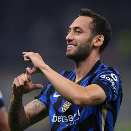 Milan, Italy, 1st October 2024. Hakan Calhanoglu of FC Internazionale celebrates after scoring to give the side a 1-0 lead during the UEFA Champions League match at Giuseppe Meazza, Milan. Picture credit should read: Jonathan Moscrop Sportimage EDITORIAL USE ONLY. No use with unauthorised audio, video, data, fixture lists, club league logos or live services. Online in-match use limited to 120 images, no video emulation. No use in betting, games or single club league player publications. SPI-3339-0016