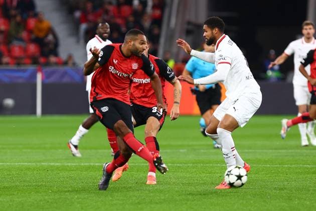 Aleix Garcia 24 Bayer 04 Leverkusen Jonathan Tah 4 Bayer 04 Leverkusen in duel, action, with Ruben Loftus Cheek 8 AC Milan Bayer 04 Leverkusen vs AC Milan, Football, UEFA Champions League, Matchday 2, 01 10 2024 Photo kolbert press Ant Palmer BayArena NRW Germany Copyright: xkolbert-press AntxPalmerx