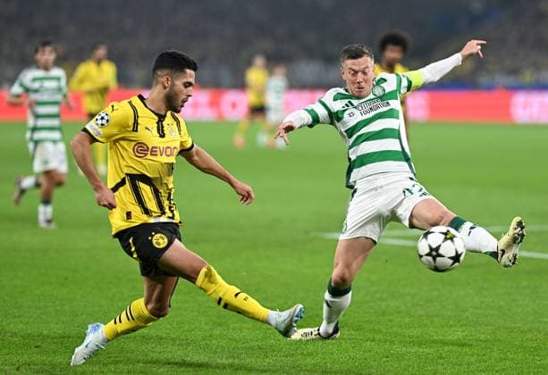 Yan Couto of Borussia Dortmund under pressure from Callum McGregor of Celtic Borussia Dortmund v Celtic, UEFA Champions League, Group Stage, Football, Signal Iduna Park, Dortmund, Germany, 01 Oct 2024 EDITORIAL USE ONLY No use with unauthorised audio, video, data, fixture lists, club league logos or live services. Online in-match use limited to 120 images, no video emulation. No use in betting, games or single club league player publications. Copyright: xMichaelxTitgemeyer Shutterstockx 14750161s