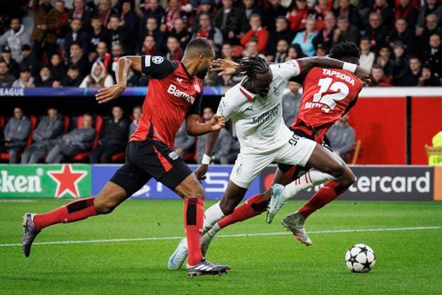 UEFA Champions League, Bayer 04 Leverkusen AC Milan 01 10 2024 Tammy Abraham AC Milan, 90 fights in the penalty area against Jonathan Tah Bayer 04 Leverkusen, 4 and Edmond Tapsoba Bayer 04 Leverkusen, 12 UEFA Champions League, Bayer 04 Leverkusen AC Milan, matchday 2 on 01 10 2024 at BayArena in Leverkusen Copyright: xBEAUTIFULxSPORTS AxelxKohringx