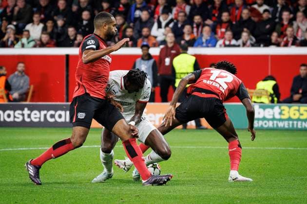 UEFA Champions League, Bayer 04 Leverkusen AC Milan 01 10 2024 Tammy Abraham AC Milan, 90 fights in the penalty area against Jonathan Tah Bayer 04 Leverkusen, 4 and Edmond Tapsoba Bayer 04 Leverkusen, 12 UEFA Champions League, Bayer 04 Leverkusen AC Milan, matchday 2 on 01 10 2024 at BayArena in Leverkusen Copyright: xBEAUTIFULxSPORTS AxelxKohringx