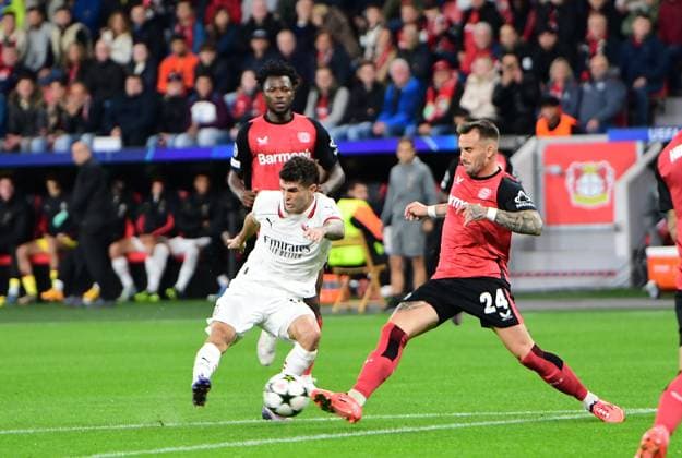 01 10 2024 Leverkusen Football, Men, UEFA Champions League,Matchday 2, Season 2024 2025, Bayer 04 Leverkusen vs AC Milan Christian Pulisic Milan, left pulls away Aleix Garcia Leverkusen, right tries to block DFL regulations prohibit any use of photographs as image sequences and or quasi video BayArena NRW Germany