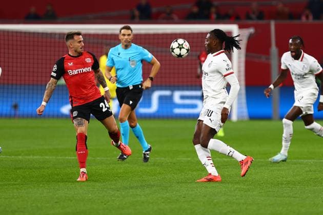 Rafael Leao 10 AC Milan in duel, action, with Aleix Garcia 24 Bayer 04 Leverkusen Bayer 04 Leverkusen vs AC Milan, Soccer, UEFA Champions League, Matchday 2, 01 10 2024 Photo kolbert press Ant Palmer BayArena NRW Germany Copyright: xkolbert-press AntxPalmerx