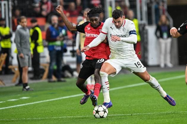 from left in duel Jeremie Frimpong Leverkusen 30 Theo Hernandez AC Milan 19 01 10 2024 Soccer Champions League, Bayer Leverkusen vs AC Milan, BayArena, Leverkusen, NRW Germany Copyright: xpepphotox xHorstxMauelshagenx pep00321, pep_20241001_hm_0873