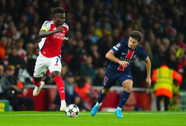 Bukayo Saka of Arsenal gets away from Joao Neves of PSG Arsenal v Paris Saint-Germain, UEFA Champions League, Group Stage, Football, Emirates Stadium, London, UK, 01 Oct 2024 EDITORIAL USE ONLY No use with unauthorised audio, video, data, fixture lists, club league logos or live services. Online in-match use limited to 120 images, no video emulation. No use in betting, games or single club league player publications. Copyright: xJavierxGarcia Shutterstockx 14750159z