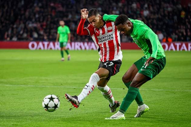 EINDHOVEN, 01-10-2024, Philips Stadium, UEFA Champions League season 2024 25, match between PSV and Sporting CP, Player PSV Mauro Junior vs Player Sporting CP Geny Catamo PSV - Sporting CP  x26369303x Copyright: