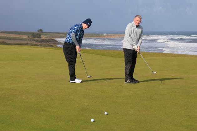 1st October 2024; Kingsbarns Golf Links, Fife, Scotland; Alfred Dunhill Links Golf Championship, Second Practice Day; Robert Macintyre of Scotland and father Dougie putt on the fourth green on Kingsbarns Golf Links, during a practice round ahead of the Dunhill Links Championship  ActionPlus12698760 DavidxYoung