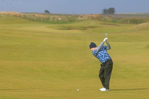 1st October 2024; Kingsbarns Golf Links, Fife, Scotland; Alfred Dunhill Links Golf Championship, Second Practice Day; Robert Macintyre of Scotland hits a shot from the fairway on the third hole on Kingsbarns Golf Links, during a practice round ahead of the Dunhill Links Championship  ActionPlus12698737 DavidxYoung
