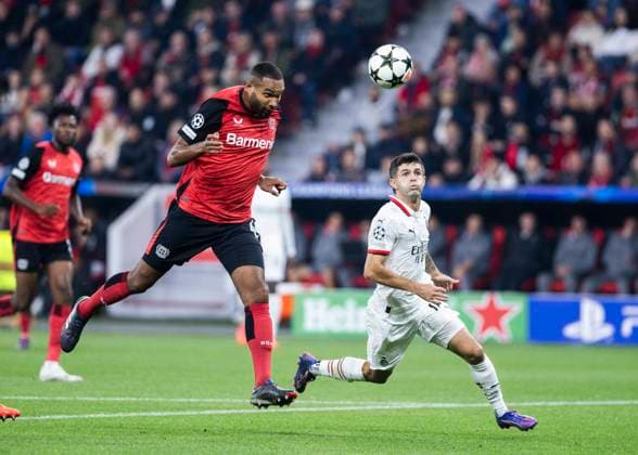 Leverkusen, Bayarena, 01 10 2024 Jonathan Tah of Leverkusen with a header during Champions League match Bayer 04 Leverkusen vs AC Milan