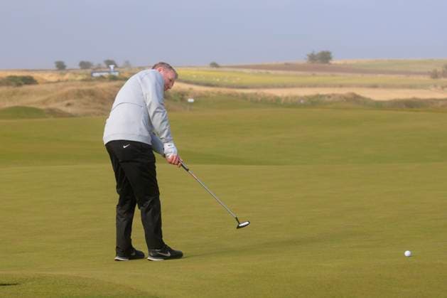 1st October 2024; Kingsbarns Golf Links, Fife, Scotland; Alfred Dunhill Links Golf Championship, Second Practice Day; Dougie MacIntyre, father of Bob, putts on the fourth green on Kingsbarns Golf Links, during a practice round ahead of the Dunhill Links Championship  ActionPlus12698741 DavidxYoung