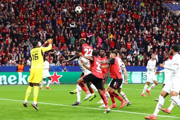 Goal chance for Victor Boniface 22 Bayer 04 Leverkusen Parade by Mike Maignan 16 AC Milan Bayer 04 Leverkusen vs AC Milan, Football, UEFA Champions League, Matchday 2, 01 10 2024 Photo kolbert press Ant Palmer BayArena NRW Germany Copyright: xkolbert-press AntxPalmerx