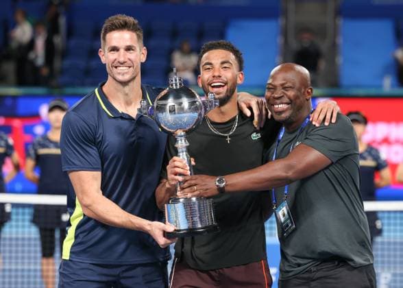 Fitness coach Fabien Cosmao, father Jean Fils and winner Arthur Fils with trophy, trophy ceremony, presentation final, final, Kinoshita Group Japan Open Tennis Championships, Tokyo, Japan Copyright: xJuergenxHasenkopfx