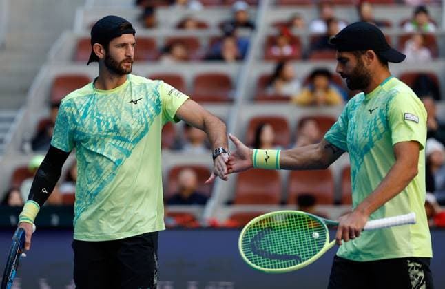 (241002) -- BEIJING, Oct. 2, 2024 -- Simone Bolelli (R) Andrea Vavassori celebrate scoring during the men s doubles final between Simone Bolelli Andrea Vavassori of Italy and Harri Heliovaara (Finland) Henry Patten (Britain) at the 2024 China Open tennis tournament in Beijing, China, Oct. 2, 2024. ) (SP)CHINA-BEIJING-TENNIS-CHINA OPEN-MEN S DOUBLES-FINAL (CN) WangxLili 