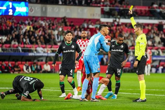 UEFA Champions League: Girona FC v Feyenoord Girona - Ivan Martin of Girona FC, Referee Urs Schnyder during the second round of new format of the UEFA Champions League 2024 2025. The match is set between Girona FC and Feyenoord at Estadi Montilivi on 2 October 2024 in Girona, Spain. Copyright: xYannickxVerhoevenx