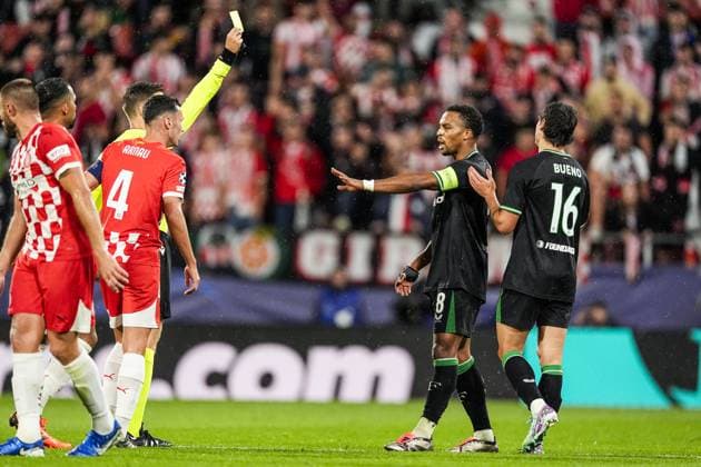 UEFA Champions League: Girona FC v Feyenoord Girona - Referee Urs Schnyder, Hugo Bueno of Feyenoord during the second round of new format of the UEFA Champions League 2024 2025. The match is set between Girona FC and Feyenoord at Estadi Montilivi on 2 October 2024 in Girona, Spain. Copyright: xTomxBodex