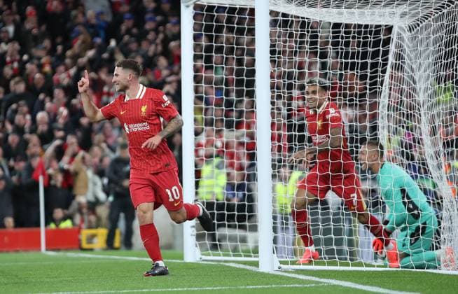 Liverpool, England, 2nd October 2024. Alexis Mac Allister of Liverpool celebrates after scoring the opening goal during the UEFA Champions League match at Anfield, Liverpool. Picture credit should read: Jessica Hornby Sportimage EDITORIAL USE ONLY. No use with unauthorised audio, video, data, fixture lists, club league logos or live services. Online in-match use limited to 120 images, no video emulation. No use in betting, games or single club league player publications. SPI-3353-0004