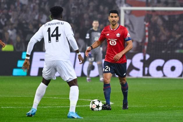 Benjamin Andre ( 21 - Lille ) and Aurelien Tchouameni ( 14 - Real Madrid ) during the UEFA Champions League match between Lille OSC and Real Madrid CF at Stade Pierre Mauroy on October 02, 2024 in Lille, France. ( Photo by federico pestellini panoramic ) - FOOTBALL : Lille vs Real Madrid - Ligue des Champions - 02 10 2024 FedericoPestellini Panoramic 