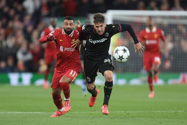 Mohamed Salah of Liverpool and Juan Miranda of Bologna Liverpool v Bologna, UEFA Champions League, Group Stage, Football, Anfield, Liverpool, UK, 02 Oct 2024 EDITORIAL USE ONLY No use with unauthorised audio, video, data, fixture lists, club league logos or live services. Online in-match use limited to 120 images, no video emulation. No use in betting, games or single club league player publications. Copyright: xPhilxOldham Shutterstockx 14750771q