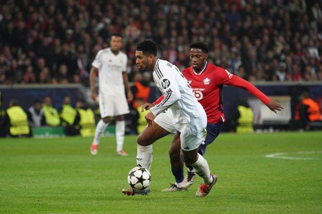 Jude Bellingham of Real Madrid and Jonathan David of Lille Lille v Real Madrid, UEFA Champions League, Group Stage, Football, Pierre Mauroy Stadium, Lille, France, 02 Oct 2024 EDITORIAL USE ONLY No use with unauthorised audio, video, data, fixture lists, club league logos or live services. Online in-match use limited to 120 images, no video emulation. No use in betting, games or single club league player publications. Copyright: xDavexWinter Shutterstockx 14750773bh