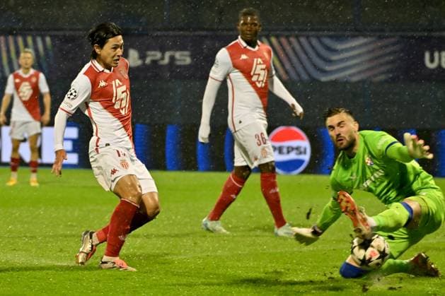 Takumi Minamino of Monaco (L) in action against Ivan Nevistic of Dinamo Zagreb (R) during the UEFA Champions League, League phase football match between Dinamo Zagreb and Monaco FOOTBALL : Dinamo Zagreb vs AS Monaco - UEFA Ligue des Champions 2024 2025 - 02 10 2024 IgorKupljenik Panoramic 