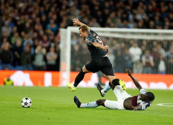 Harry Kane of Bayern Munich is tackled by Amadou Onana of Aston Villa Aston Villa v Bayern Munich, Football, UEFA Champions League, Villa Park, Birmingham, UK - 02 10 2024 Editorial use only  Copyright: xMattxImpey Shutterstockx 14752829ax