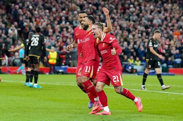 Liverpool FC v Bologna FC Liverpool forward Mohamed Salah (11) scores a GOAL 2-0 with Liverpool defender Kostas Tsimikas (21) Liverpool forward Cody Gakpo (18) during the Liverpool FC v Bologna FC UEFA Champions League Round 1 match at Anfield, Liverpool, England, United Kingdom on 2 October 2024 Editorial use only. All images are copyright Every Second Media Limited. No images may be reproduced without prior permission. Copyright: xIMAGO EveryxSecondxMediax ESM-1152-0092