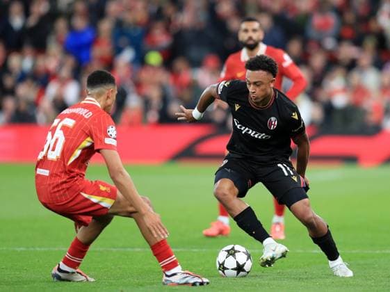 2nd October 2024; Anfield, Liverpool, Merseyside, England; Champions League Football, Liverpool versus Bologna; Dan Ndoye of Bologna takes on Trent Alexander-Arnold of Liverpool  ActionPlus12699196 DavidxBlunsden