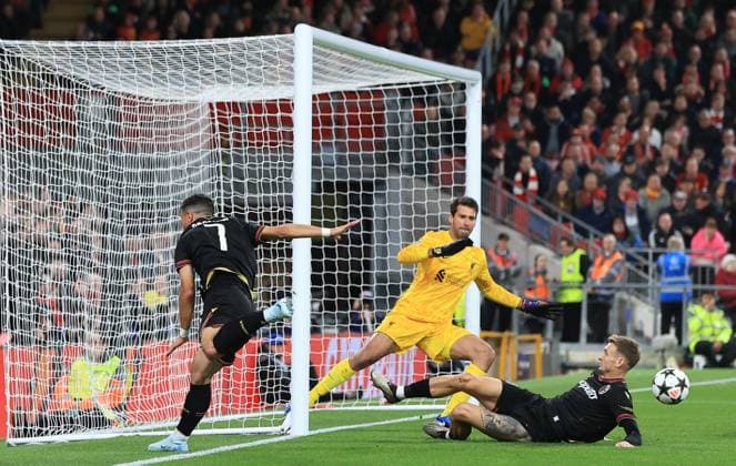 2nd October 2024; Anfield, Liverpool, Merseyside, England; Champions League Football, Liverpool versus Bologna; Liverpool goalkeeper Alisson Beckersaves a header from Riccardo Orsolini of Bologna  ActionPlus12699199 DavidxBlunsden
