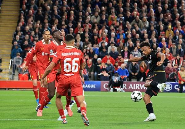2nd October 2024; Anfield, Liverpool, Merseyside, England; Champions League Football, Liverpool versus Bologna; Dan Ndoye of Bologna shoots at goal  ActionPlus12699201 DavidxBlunsden