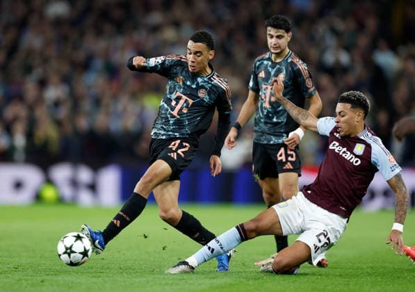 Jamal Musiala of Bayern Munich is tackled by Morgan Rogers of Aston Villa Aston Villa v Bayern Munich, Football, UEFA Champions League, Villa Park, Birmingham, UK - 02 10 2024 Editorial use only  Copyright: xMattxImpey Shutterstockx 14752829bq