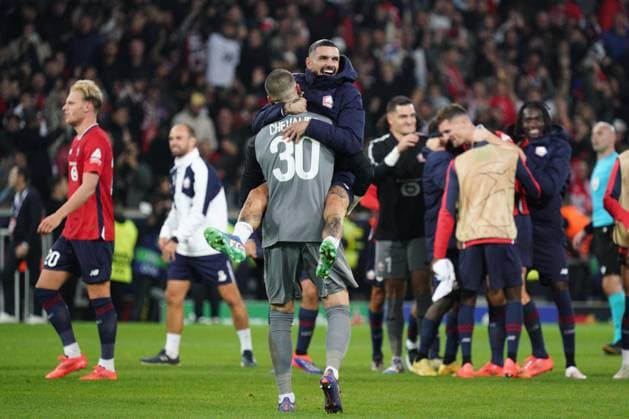 Lucas Chevalier and Remy Cabella of Lille celebrate their side s 1-0 win Lille v Real Madrid, UEFA Champions League, Group Stage, Football, Pierre Mauroy Stadium, Lille, France, 02 Oct 2024 EDITORIAL USE ONLY No use with unauthorised audio, video, data, fixture lists, club league logos or live services. Online in-match use limited to 120 images, no video emulation. No use in betting, games or single club league player publications. Copyright: xDavexWinter Shutterstockx 14750773cl