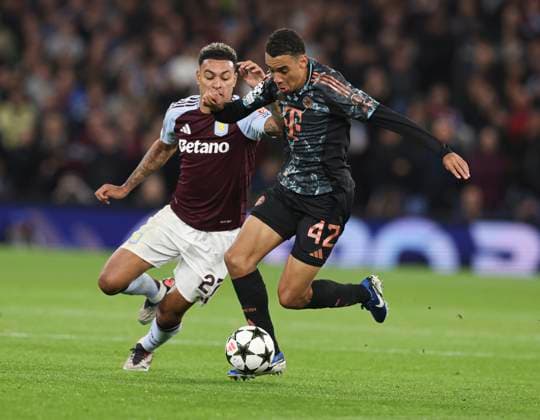 Football - 2024 2025 UEFA Champions League - League Phase - Matchday 2 8 - Aston Villa vs Bayern Munich - Villa Park - Wednesday 2nd October 2024 Morgan Rogers of Aston Villa and Jamal Musiala of Bayern Munich 