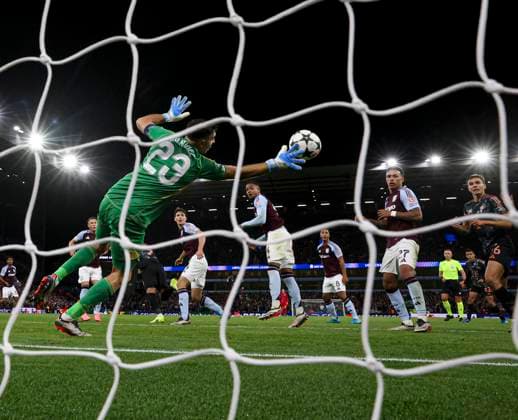 Football - 2024 2025 UEFA Champions League - League Phase - Matchday 2 8 - Aston Villa vs Bayern Munich - Villa Park - Wednesday 2nd October 2024 Emiliano Martinez of Aston Villa saves a header from Harry Kane of Bayern Munich 