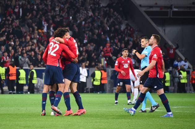 Ayyoub BOUADDI ( 32 - Lille ) , Thomas Meunier ( 12 - Lille ) and Lille players celebrate their side s victory after the UEFA Champions League match between Lille OSC and Real Madrid CF at Stade Pierre Mauroy on October 02, 2024 in Lille, France. ( Photo by federico pestellini panoramic ) - FOOTBALL : Lille vs Real Madrid - Ligue des Champions - 02 10 2024 FedericoPestellini Panoramic 