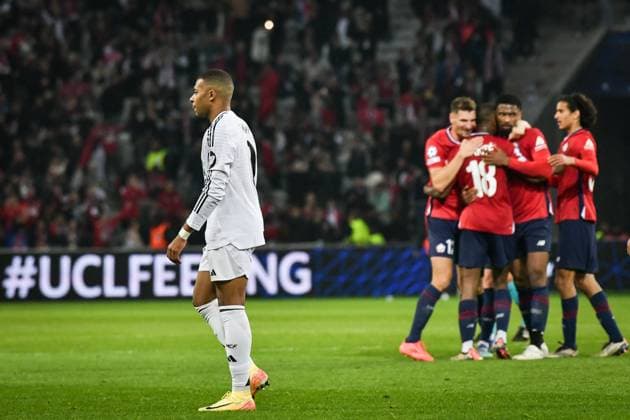 Champions League Lille vs Real Madrid FA Real Madrid’s forward Kylian Mbappe walks on the pitch as Lille’s players celebrate winning the UEFA Champions League football match between against Real Madrid CF at the Pierre Mauroy Stadium in Lille on October 2, 2024. Photo by Firas Abdullah ABACAPRESS.COM Paris Ile-de-France France  Copyright: xAbdullahxFiras ABACAx