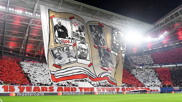 Soccer UEFA Champions League, season 2024 2025, group stage, match day 2, at the match RB Leipzig vs Juventus Turin 02 10 2024 2 3 1 0 Choreo of the fans of RB Leipzig before the match RB Leipzig vs Juventus Turin 02 10 2024 On display is an open book with pictures of former coach Ralf Rangnick, former coach Alexander Zorniger, former goalkeeper Fabio Coltorti, former player Emil Forsberg, and more In addition a saying can be read 15 Years and the story goes on Leipzig Saxony Germany Red Bull Arena